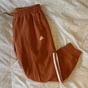 Adidas Women’s cropped jogger Burnt Orange Joggers with White Stripes Small